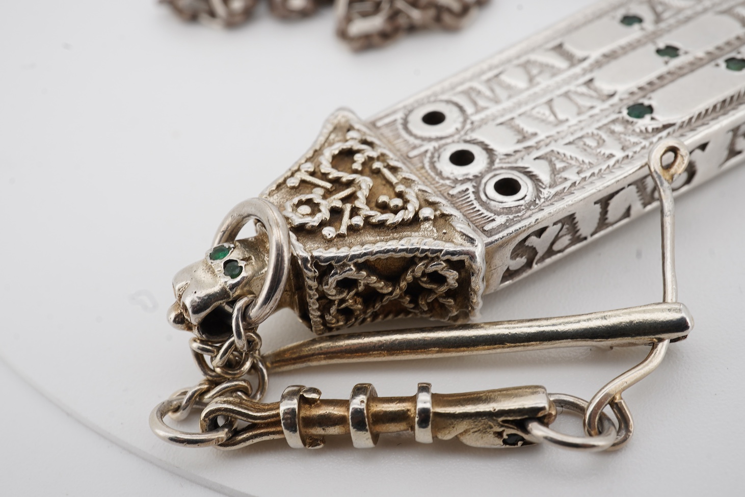 Two modern parcel gilt silver replicas of the Canterbury Pocket Sundial, the larger inset with small emeralds?, maker GF, London, 1975, the smaller later, maker DB, London, 1987, both suspended from a chain.